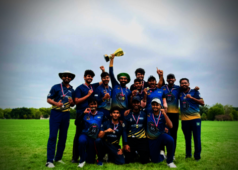UIS club cricket celebrating win and holding a trophy