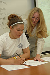 Advisor helping student with paperwork