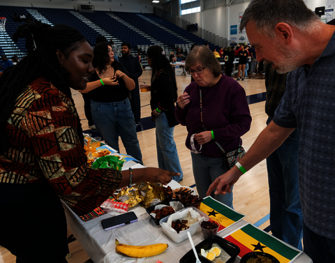 Vistors at the International Festival learning about food from Ghana.