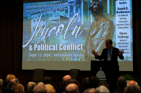 NPR's Steve Inskeep speaks at a podium.