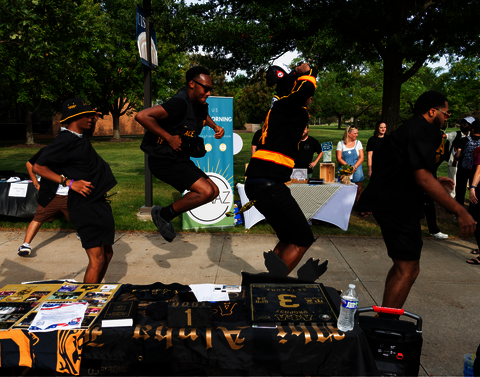 A fraternity "strolling" at the Involvement Expo.