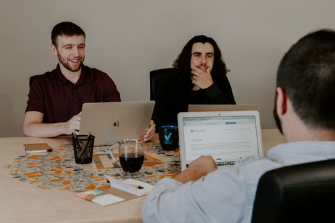 Two students talking with Advisor