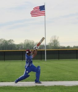 batter swinging during pitch at cricket