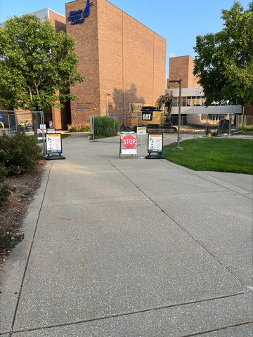 Picture of construction in front of the Library and Admissions building.