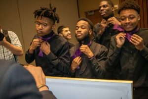 Students being inducted into the Men of Color Initiative