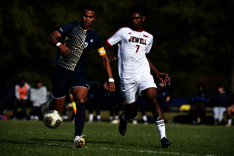 two soccer players playing soccer on the fields of Kiwanis Stadium