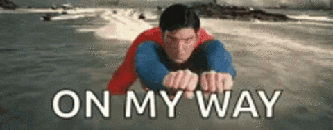 GIF of superman flying with text "On My Way"