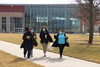 Students walk near the Student Union at UIS, which was part of the Reaching Stellar campaign.