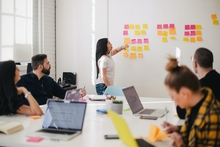 People in a boardroom doing a strategic planning exercise