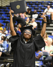 Grad holding diploma 
