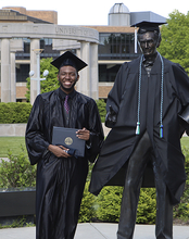 Graduate in gap and gown