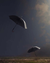 Umbrellas falling from the sky