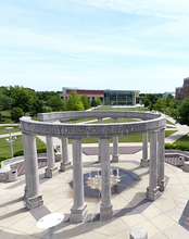 An aerial view of the UIS colonnade on the University of Illinois Springfield campus on a dunny day during the summer season.