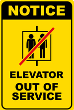Image of a sign stating that an elevator is out of service.