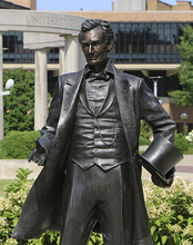 The Abraham Lincoln statue at UIS with the colonnade in the background.