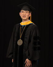 Yanhui Guo stands in regalia during his Ceremony of Investiture.