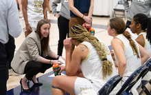Olivia Lett coaching team during timeout