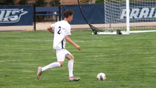Lennard Borgs playing soccer at UIS in white uniform
