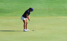 Erin Ahmadfadzir putting at UIS golf tournament