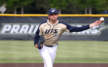 Graham Kasey pitching for UIS baseball in gold jersey
