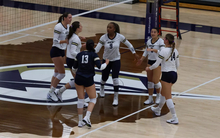 UIS volleyball team on court