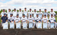 UIS baseball senior class pictured on field in uniform with their senior gifts