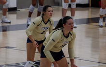 Bella Hodges and Makenna Cox await serve