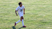 Donovan Faletto playing soccer in Prairie Stars white and gold