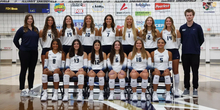 2026 UIS Volleyball team photo on court with coaches