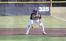 Chris Suchoski base running in golf UIS baseball uniform