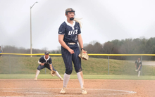 Calista Stahlhut  pitching in blue UIS uniform