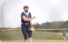 Calista Stahlhut pitching in blue UIS uniform