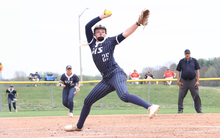 Calista Stahlhut pitching in blue UIS softball uniform