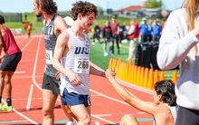 Joey Karlesky helps up teammate Matt Padilla after race