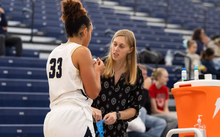 Abby Kain, athletic trainer attending to a student-athlete
