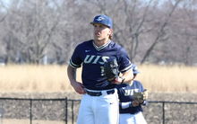 Adam Wibbenmeyer pitching for UIS baseball in blue jersey