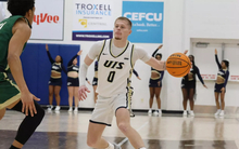 Brit Dutton playing basketball at UIS