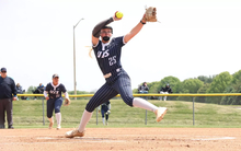 Calista Stahlhut pitching in blue UIS uniform