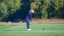 Gracie Russell golfing in UIS blue
