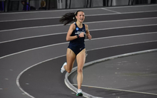 Maddie Miller-Ross running on an indoor track