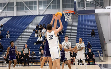 Alex Stell playing basketball at UIS