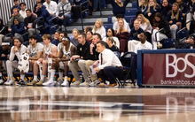 Men’s basketball bench and crowd