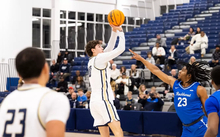 Isaiah Davis shooting a three-point shot