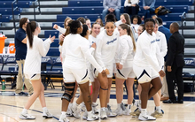Women's basketball celebratory huddle