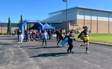 5K runners taking off from start line