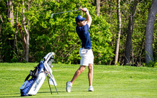 Vilgot Arleback playing golf in blue UIS polo