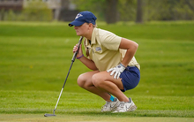 Elaine Grant preparing for a putt