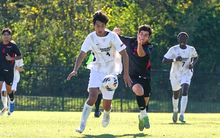 Rafael Pacino playing soccer in white UIS uniform