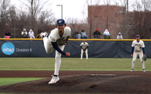 Richie Snider pitching in white UIS Baseball uniform