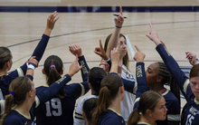 UIS volleyball team huddle